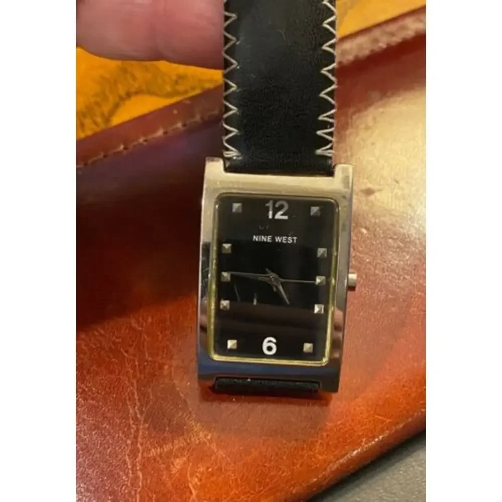 Women's Silver tone 25mm Nine West Watch, Black Face and Stitched Band
